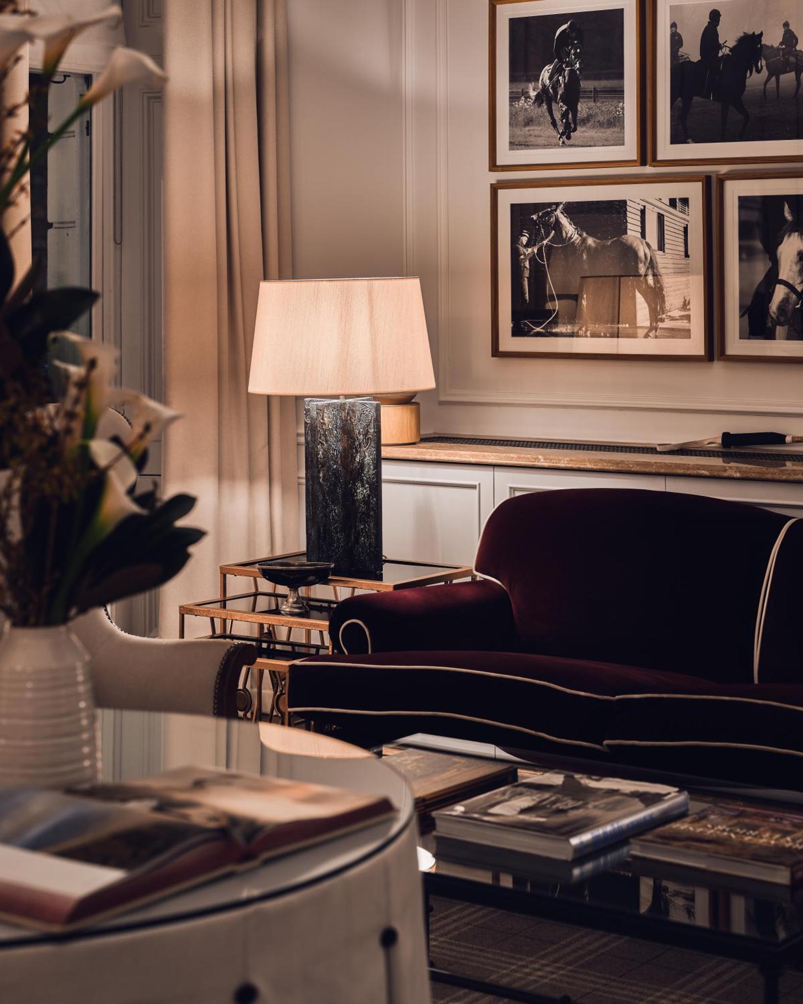 a living room with a couch and a lamp at The Adria in London