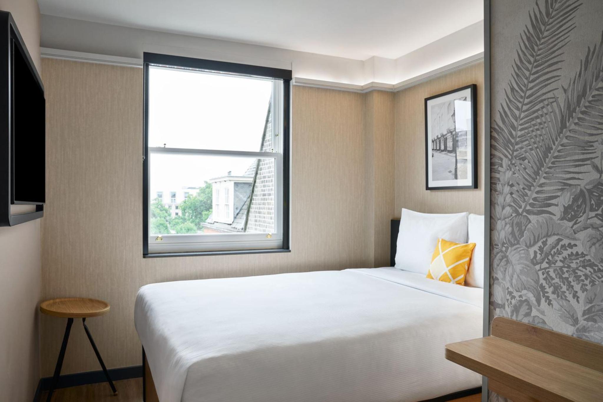 a hotel room with a bed and a window at Four Points Flex by Sheraton London Euston in London