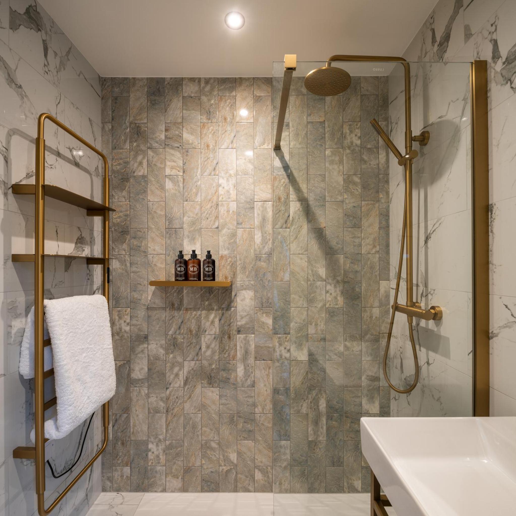 a bathroom with a shower and a sink at Ellen Kensington in London