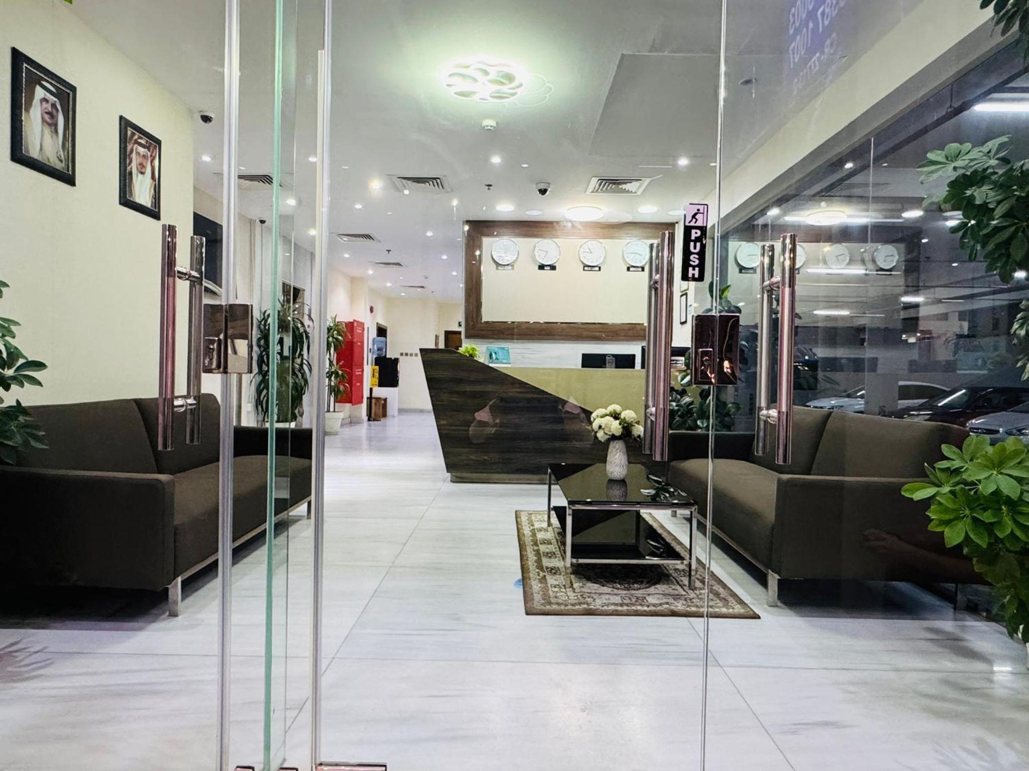 a lobby with couches and a table in a store at Tanger Tower in Manama +12 photos