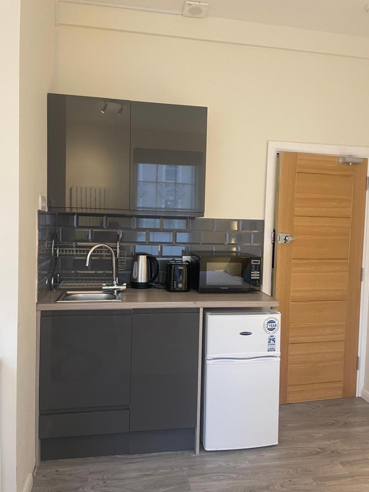 a kitchen with a sink and a dishwasher at Grays Inn Road - Room 1 in London