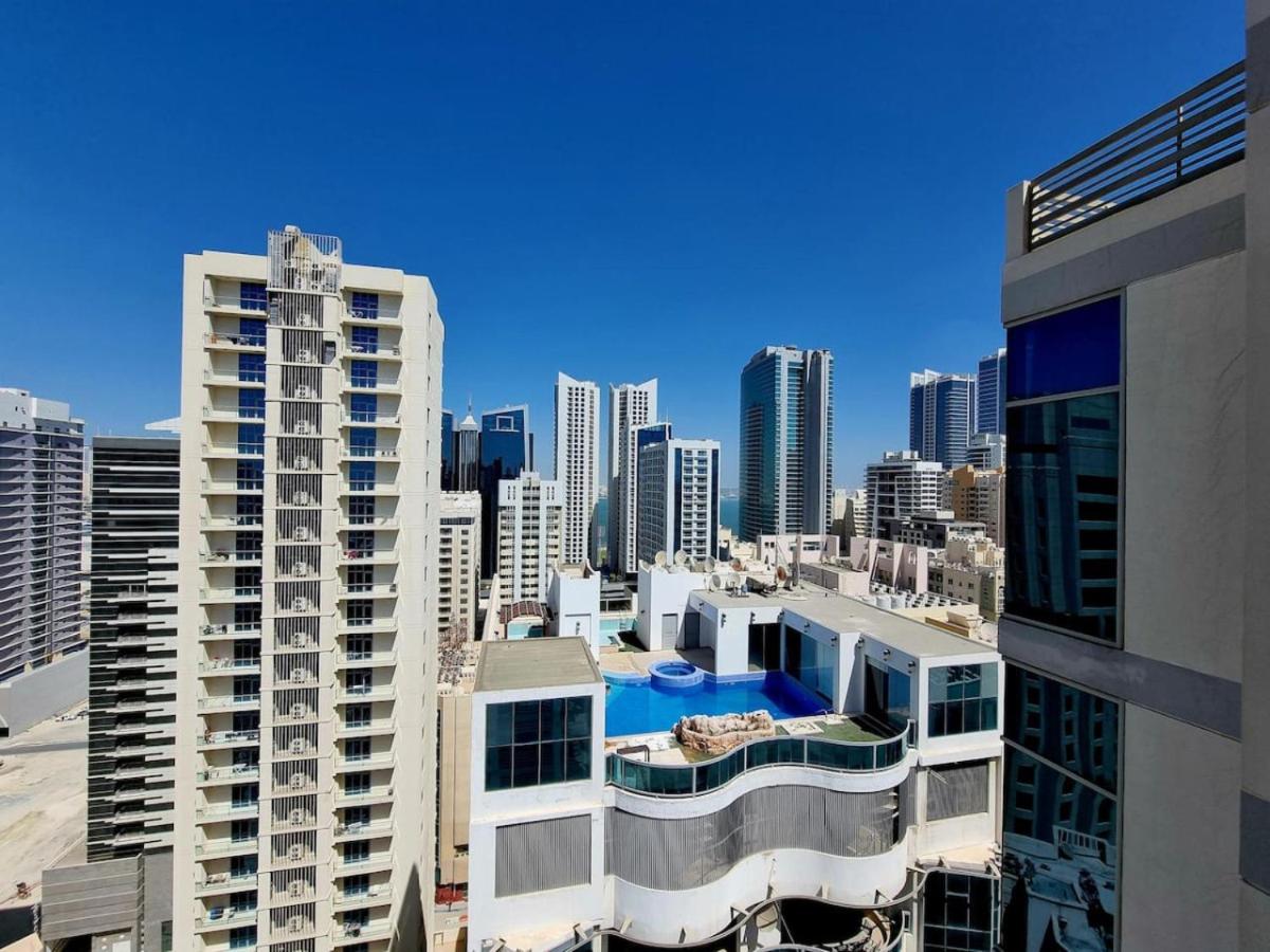 a view of a city skyline with tall buildings at Aspire Tower-Travelers Trove Juffair in Manama