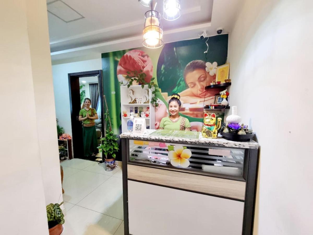 a room with a counter with a poster on the wall at Aspire Tower-One Bedroom Sunny Solo Stay in Manama