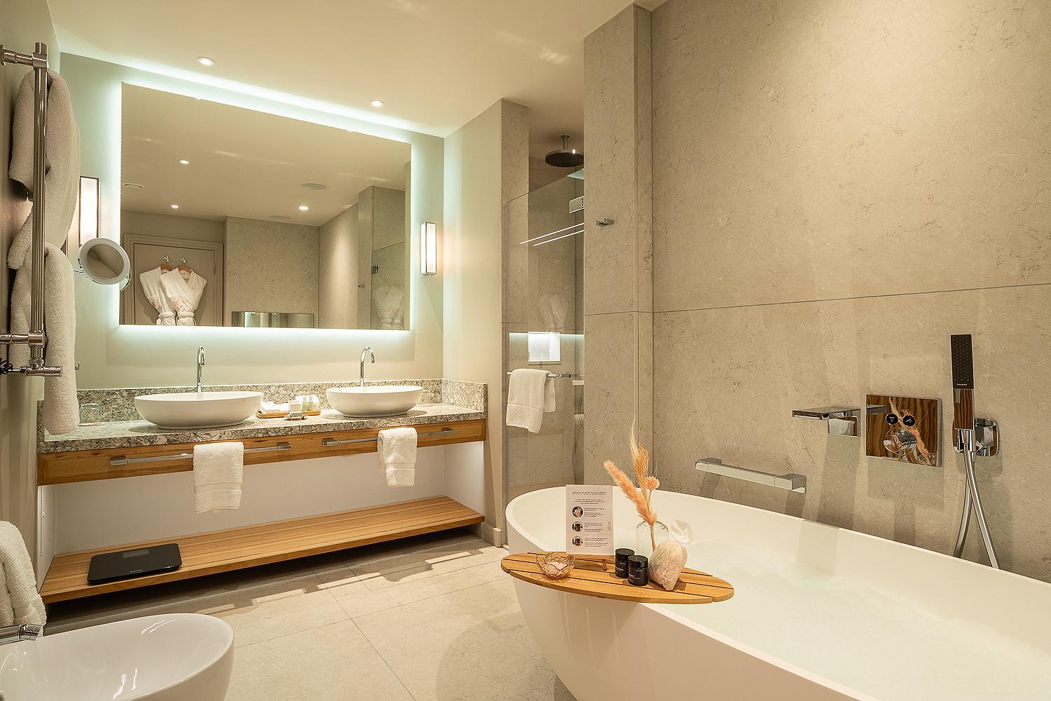 a bathroom with two sinks and a large mirror at The Prince Akatoki London in London