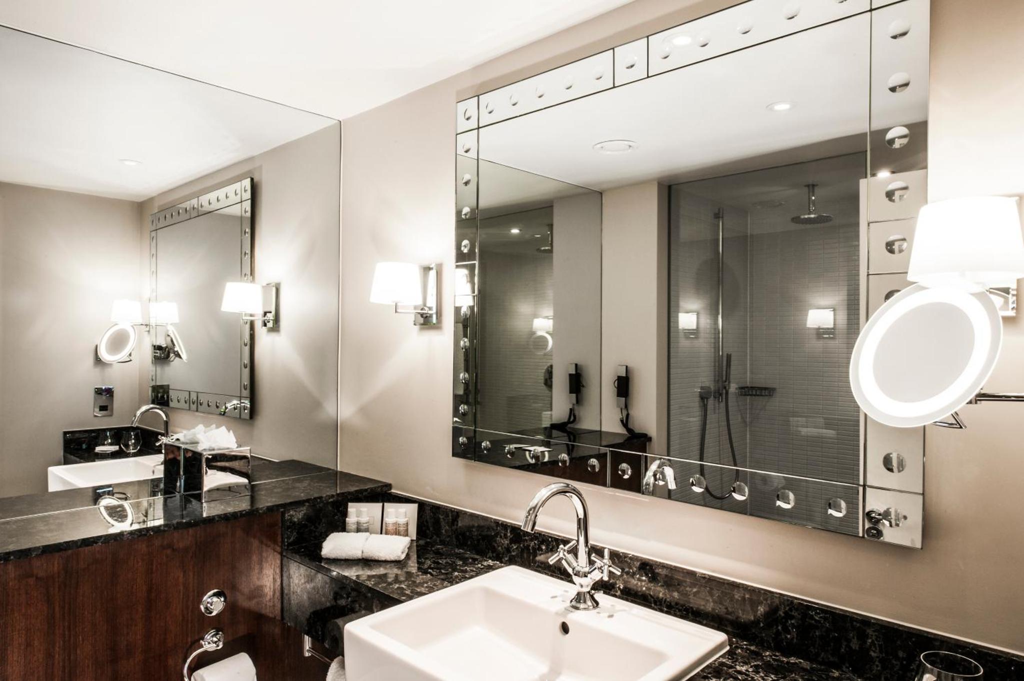 a bathroom with a sink and a mirror at The Prince Akatoki London in London +65 photos