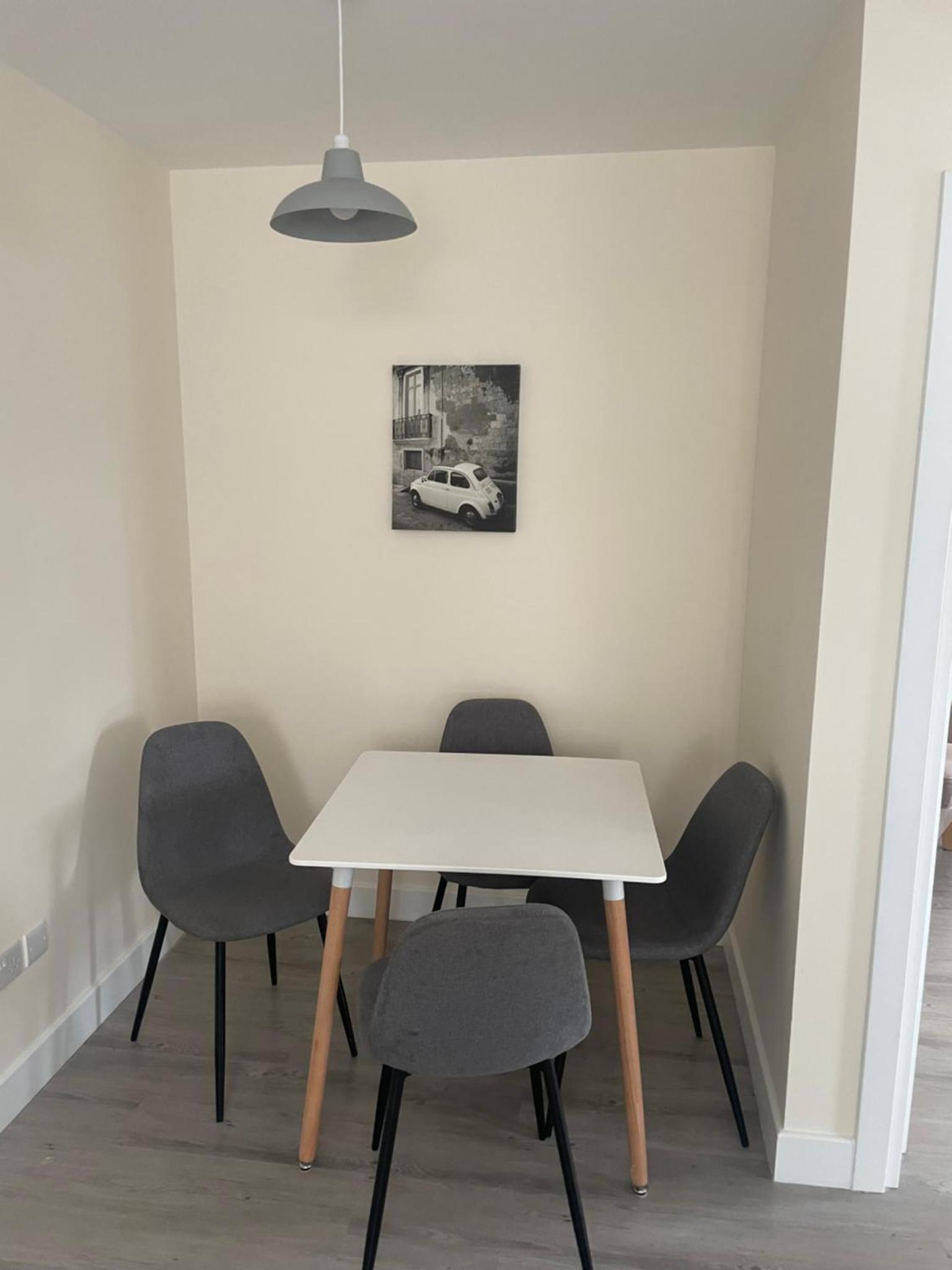 a table and four chairs in a room at Regal Hotel in London +17 photos