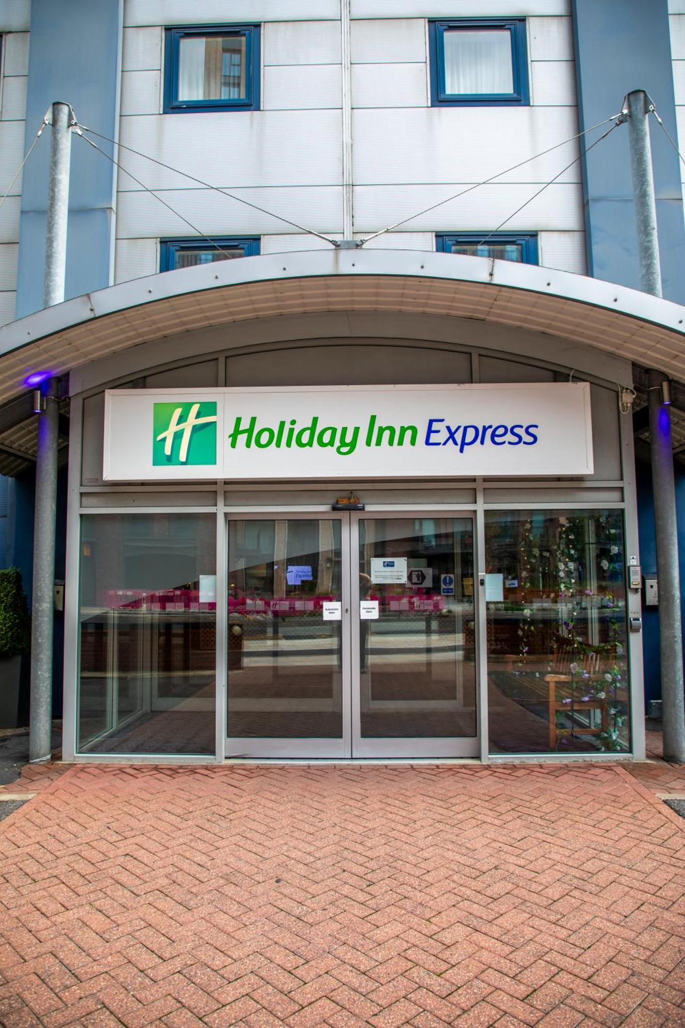 a building with a hilley inn express sign on it at Holiday Inn Express Royal Docks by IHG in London