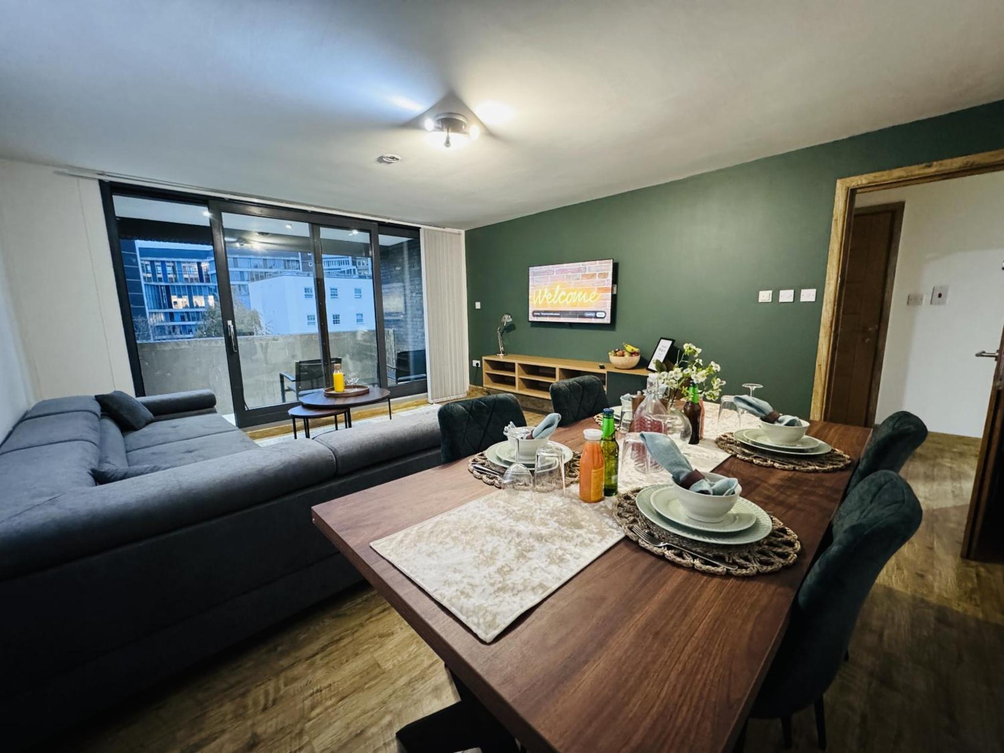 a living room with a table and a couch at The Edge FT3 in London