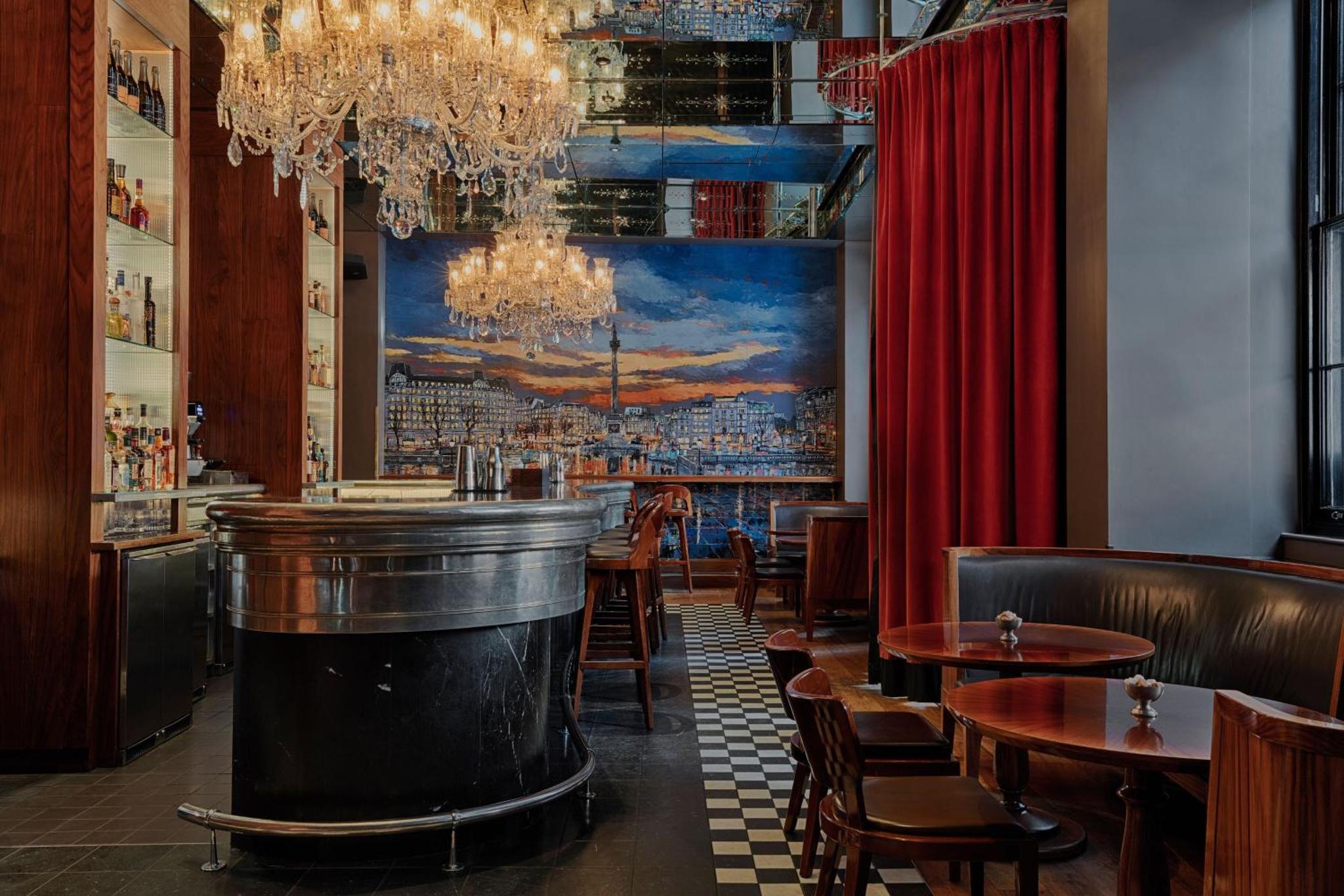 a bar with tables and chairs in a restaurant at Kaya Great Northern Hotel, London in London +61 photos