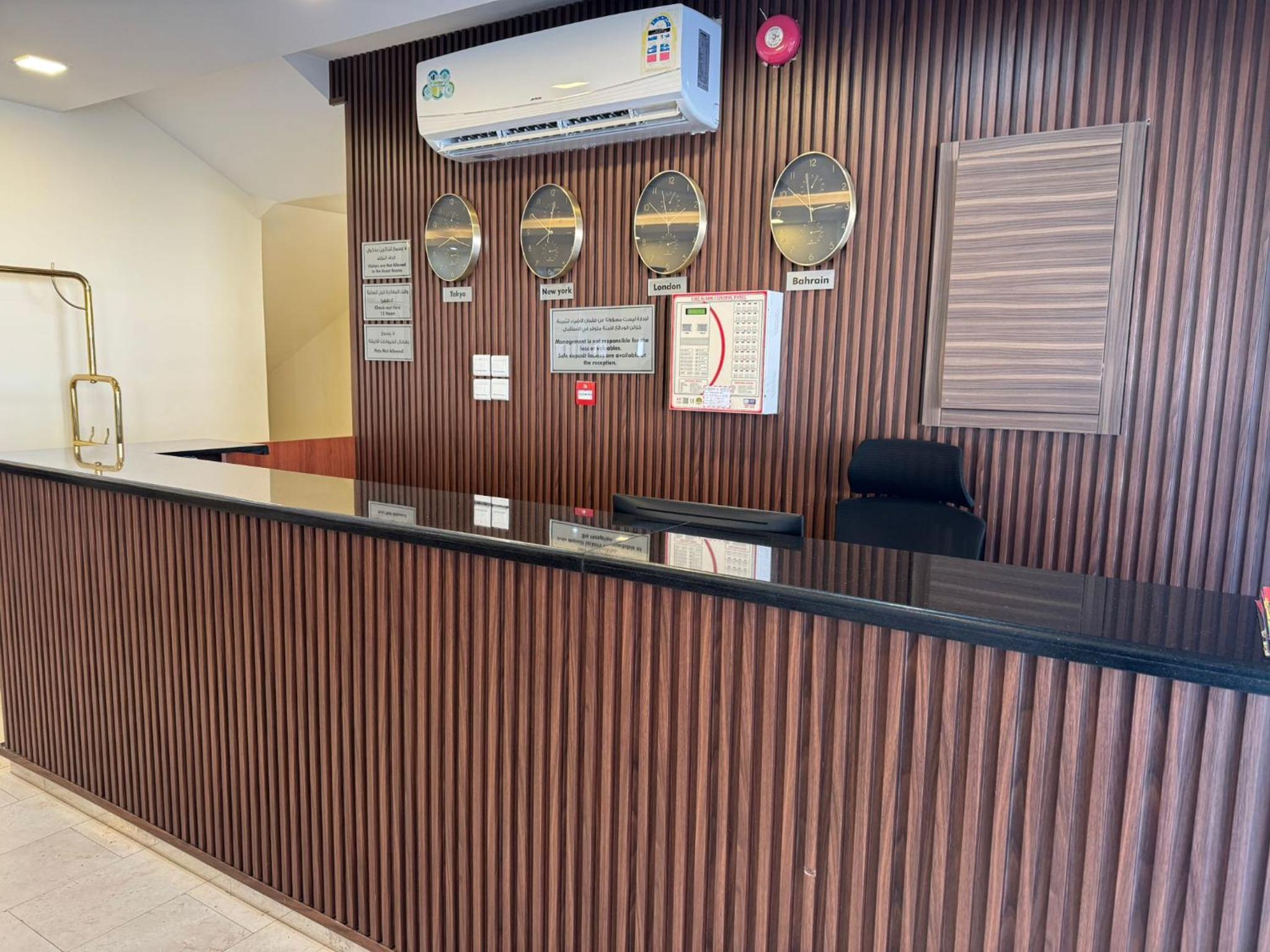 a bar in a hospital lobby with aperature at Marine Beach Apartment in Seef