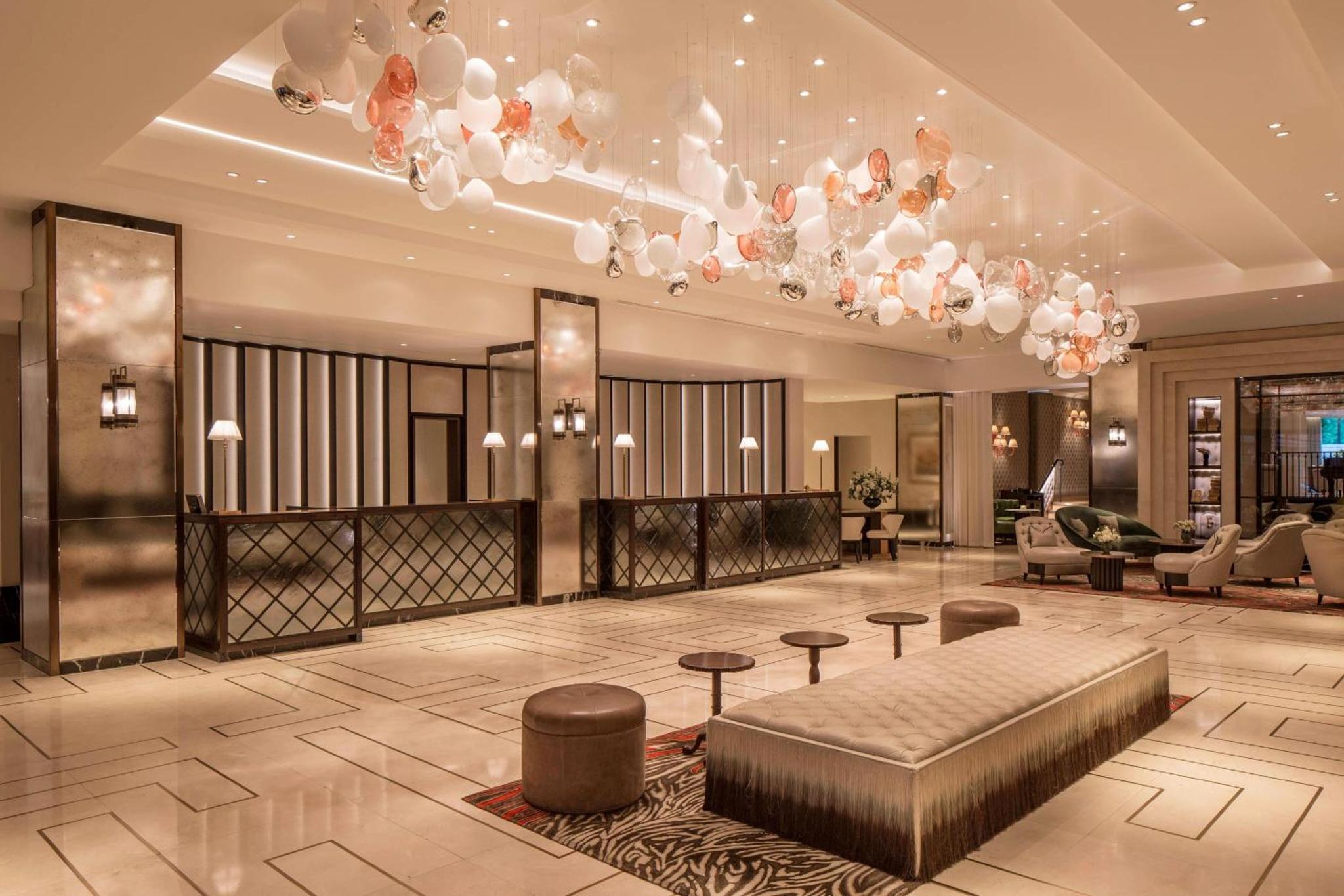 a lobby with a large chandelier in a hotel at JW Marriott Grosvenor House London in London