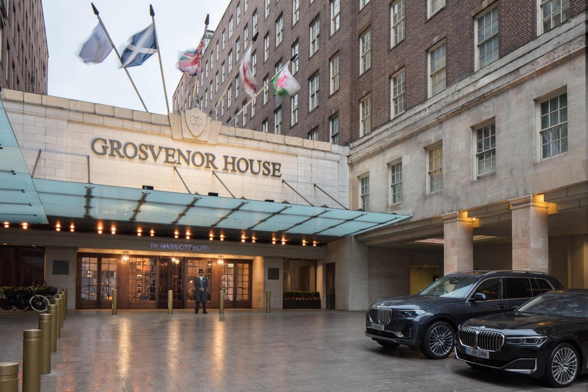 a building with a car parked in front of it at JW Marriott Grosvenor House London in London