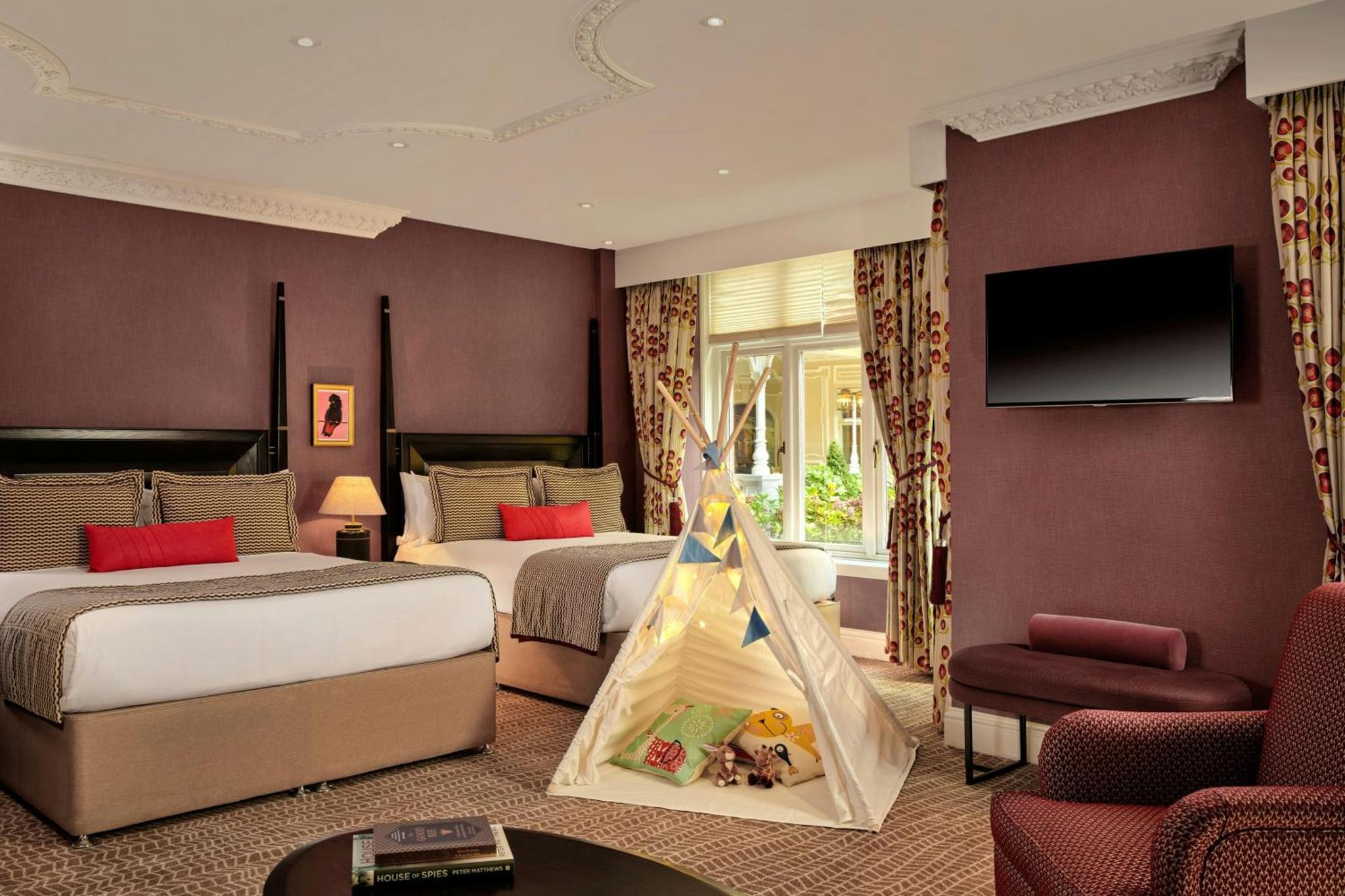a hotel room with two beds and a play tent at St. Ermin's Hotel, Autograph Collection in London