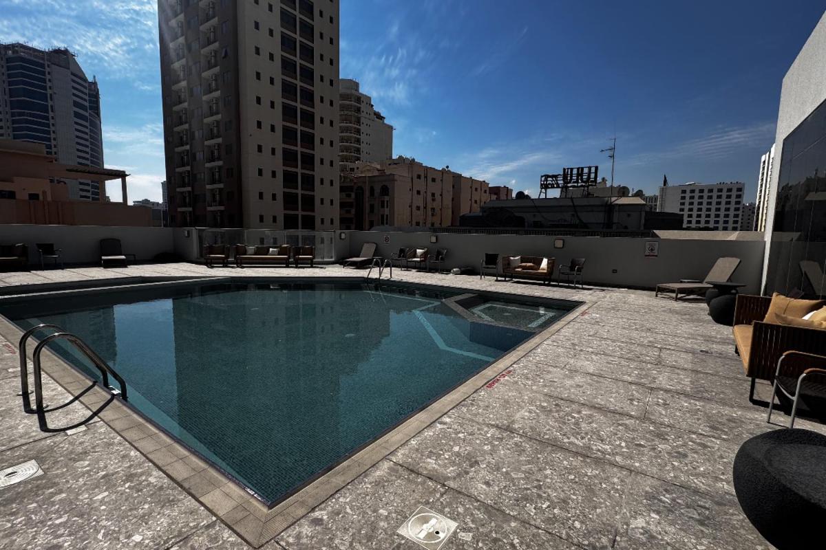 a large swimming pool on top of a building at The Mark Hotel in Manama