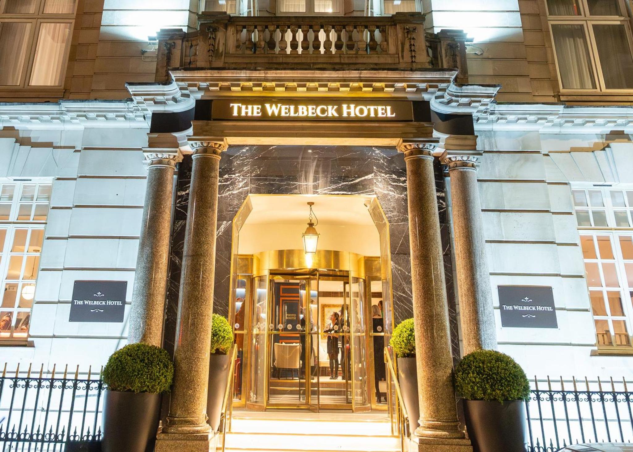 a hotel entrance with a sign that reads the wilderness hotel at The Welbeck Hotel by IHG in London