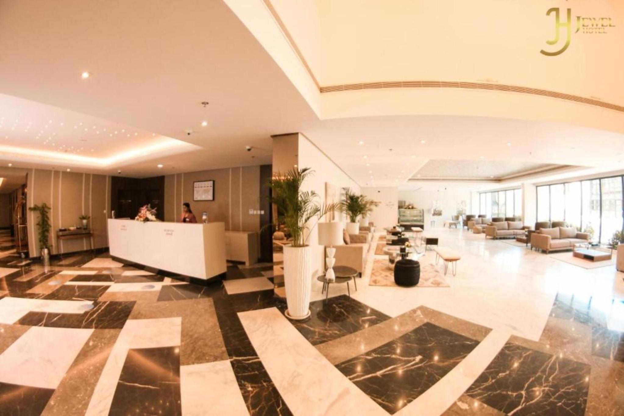 a lobby with a reception desk in a building at Dancenter Jewel Near World Trade Center in Manama
