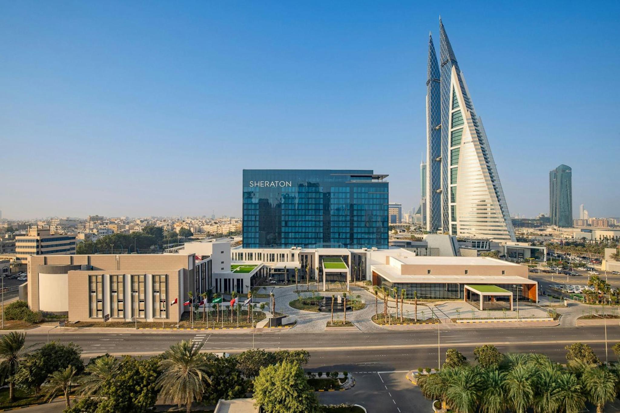 a view of a city with a tall building at Sheraton Bahrain Hotel in Manama