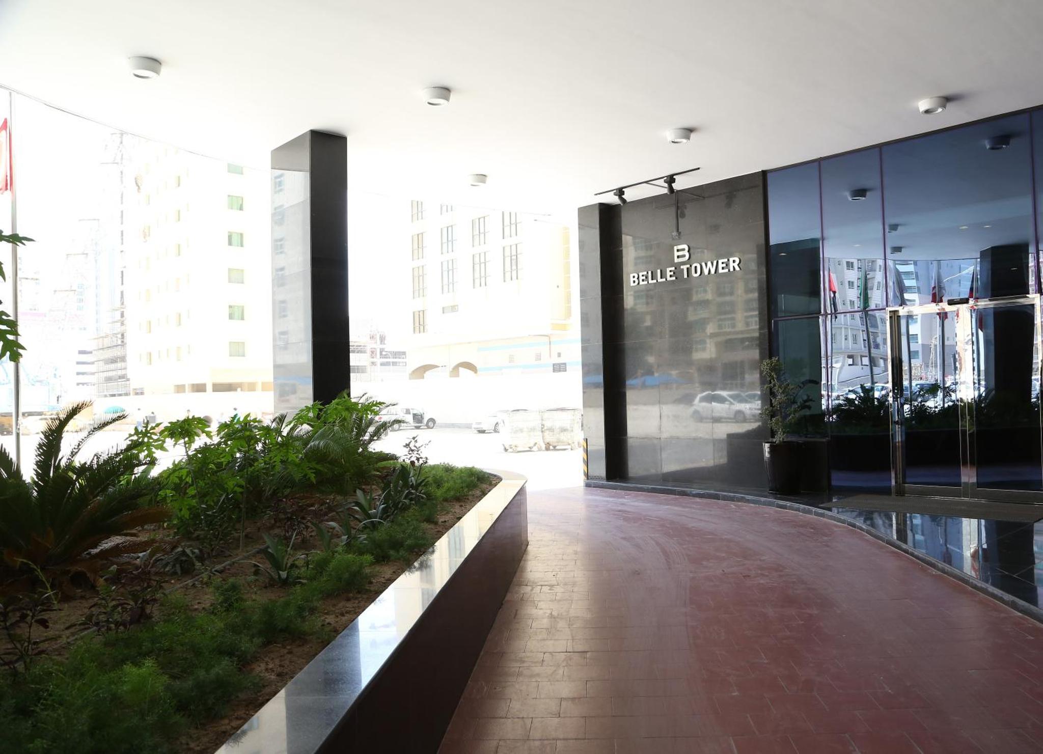 a view of a building with a glass wall at Belle Tower Apartments in Manama