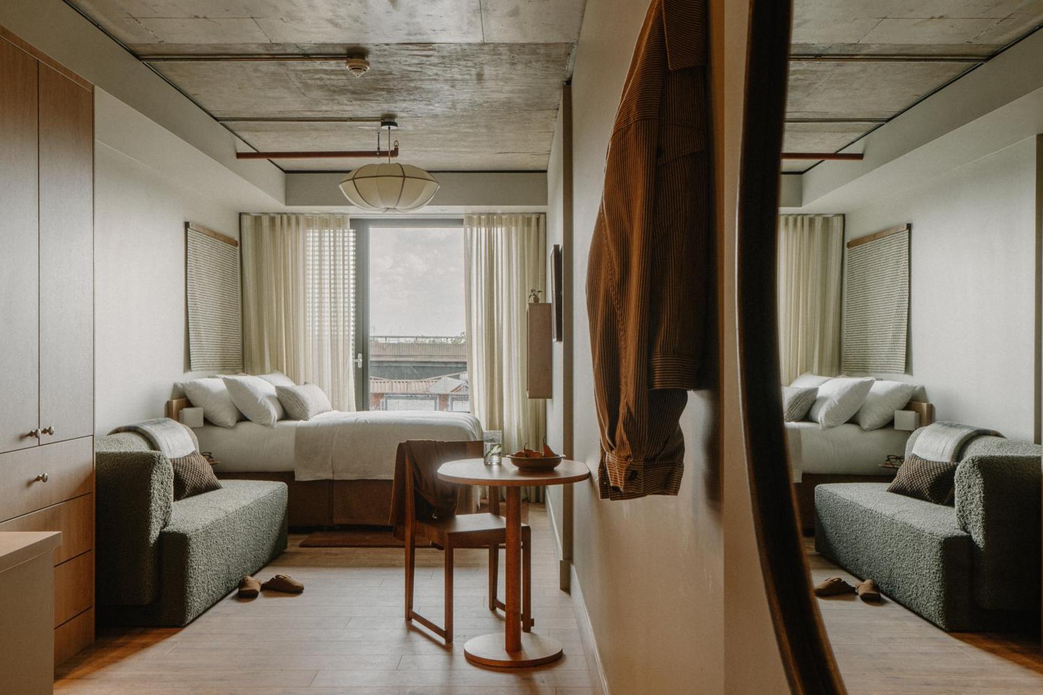 a living room with a couch and a table at Mason & Fifth, Westbourne Park in London +62 photos