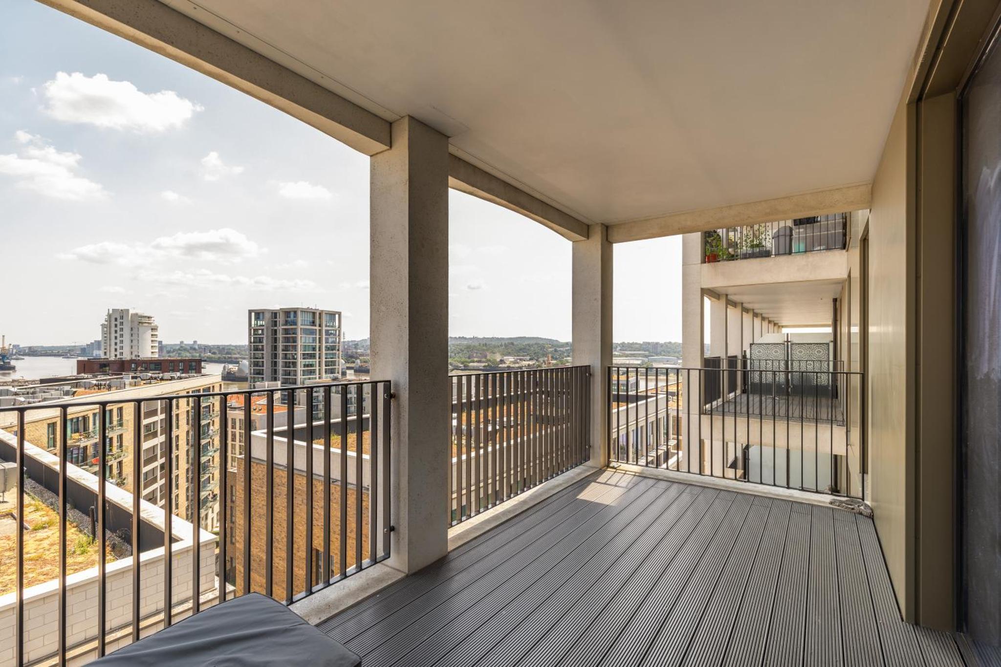 a balcony with a view of the city at Spacious modern 1 bed Apartment. in London