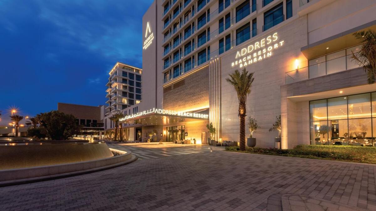 a large building with a street in front of it at Address Residences Beach Resort Bahrain in Rayyā