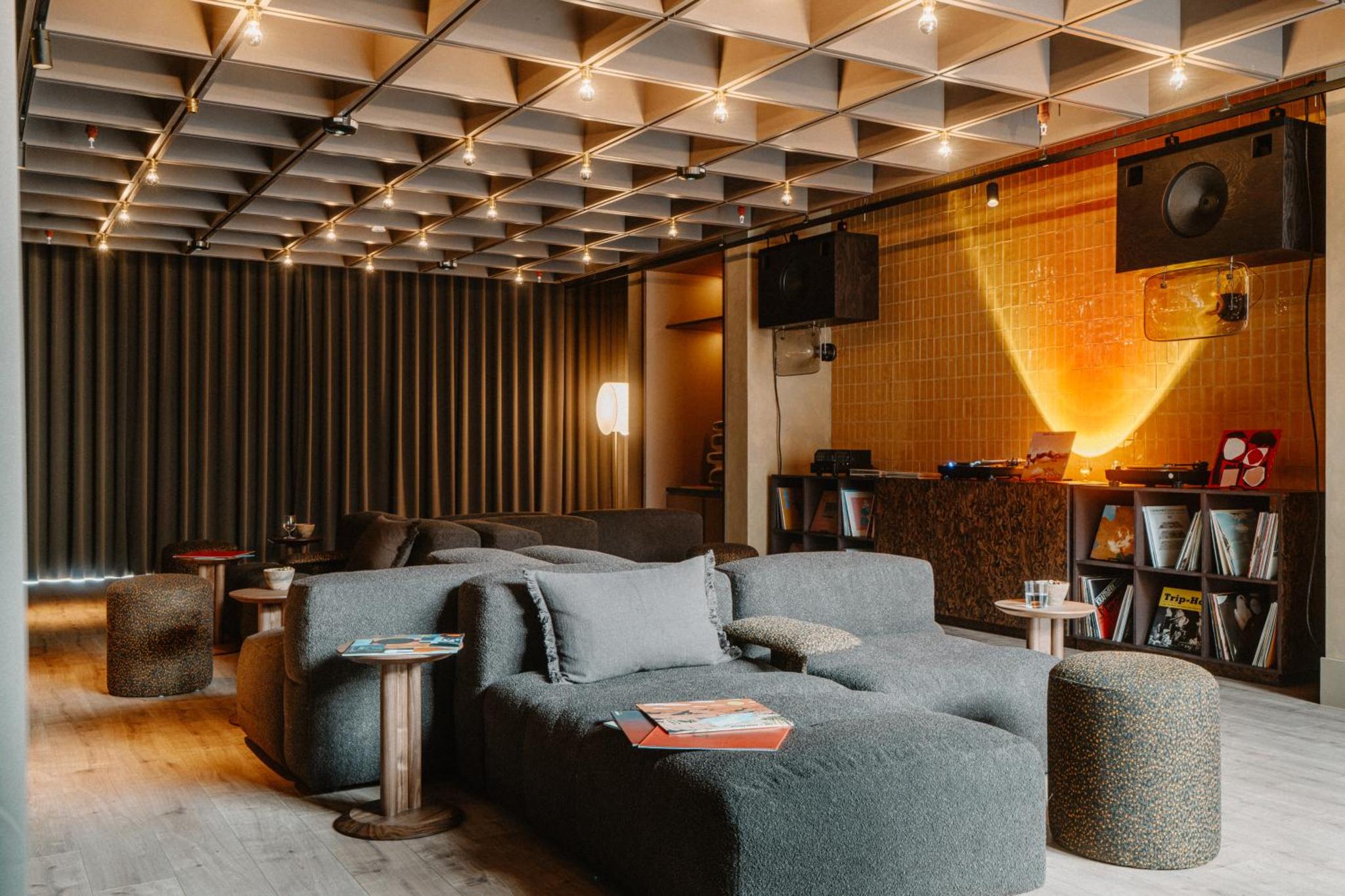 a living room with two couches and a tv at Mason & Fifth, Westbourne Park in London