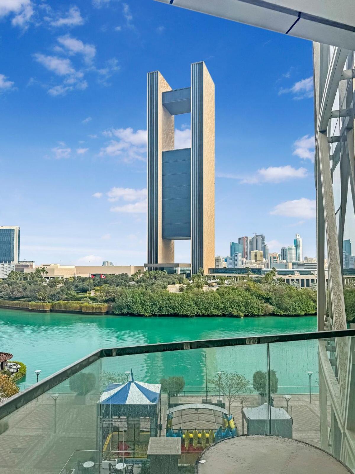 a view from the balcony of a hotel with a view at 2 Bedroom Apartment in Bahrain Bay with a four season view in Manama