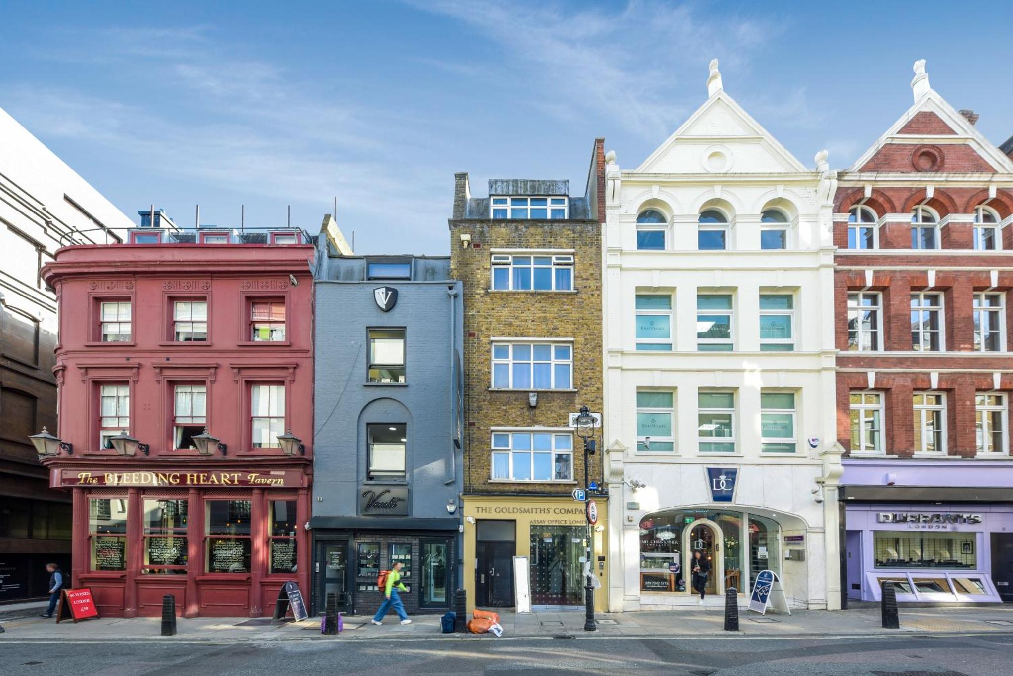 a group of buildings on a city street at Cosy Farringdon Apartments in London