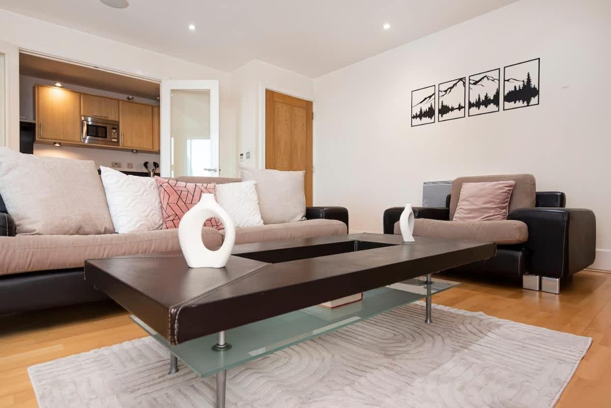 a living room with a couch and a coffee table at Charming 2 bed Thames view in London