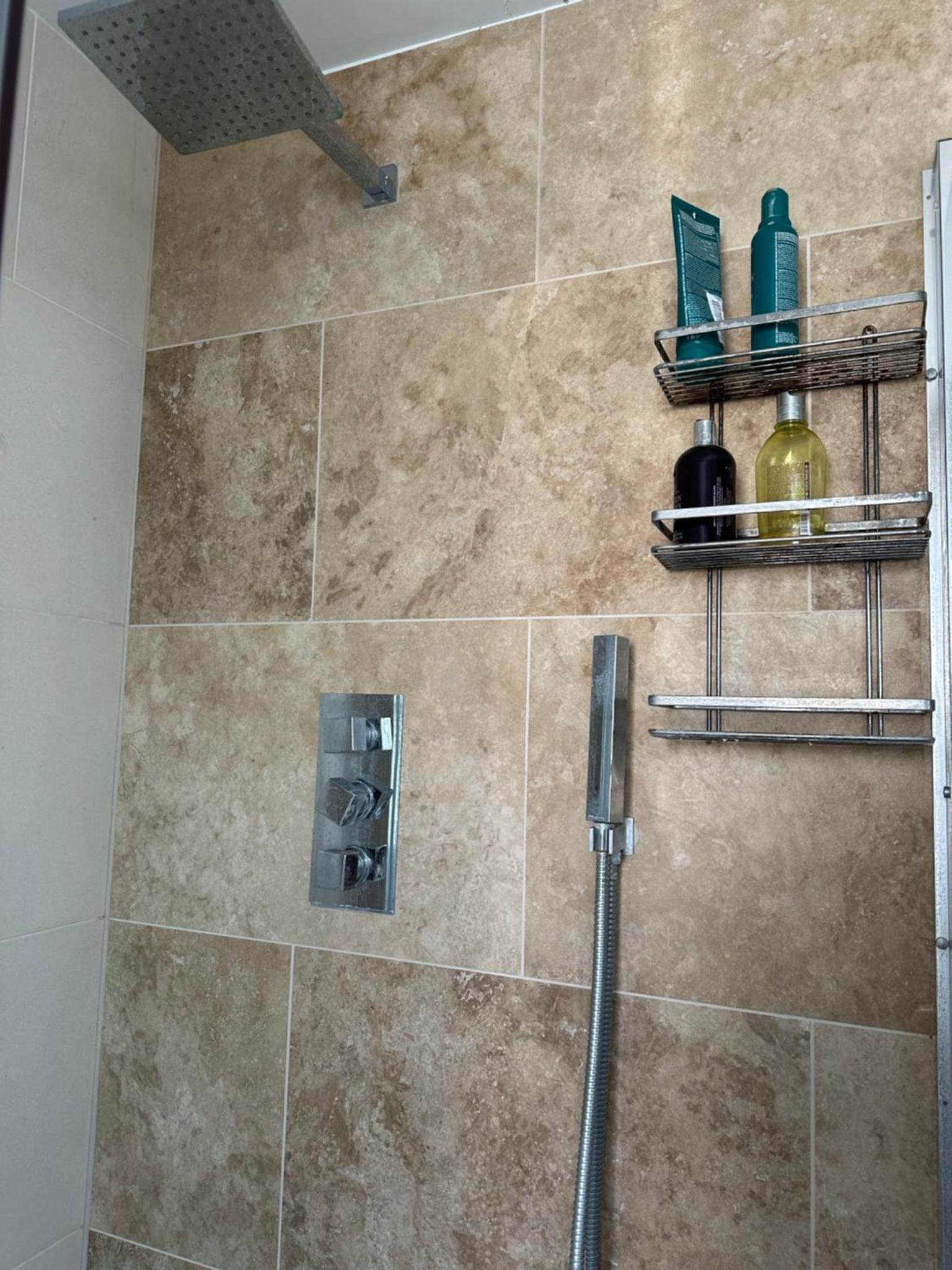 a shower in a bathroom with a tile shower at Centrally Located Boutique Townhouse in London +14 photos