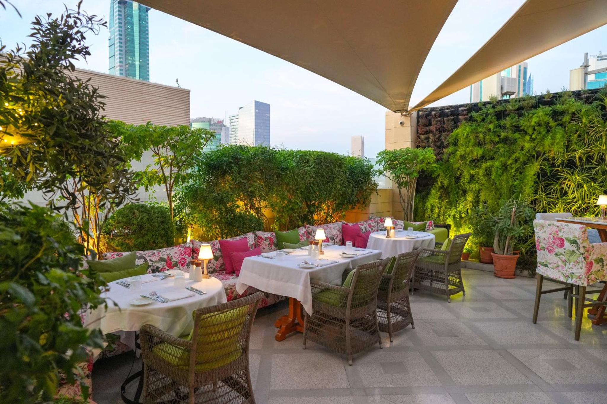 a restaurant with tables and chairs on a patio at The Merchant House in Manama