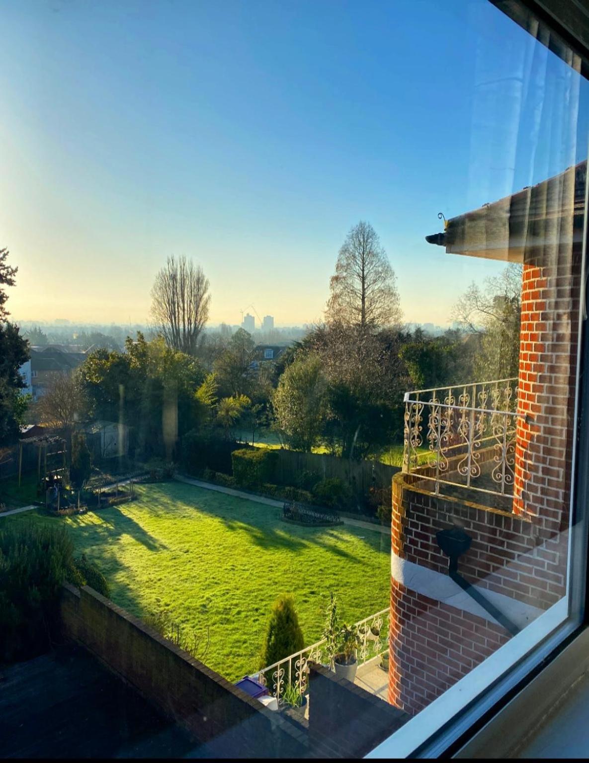 a view of a garden from a window at Prime Location Wembley Stadium London in London