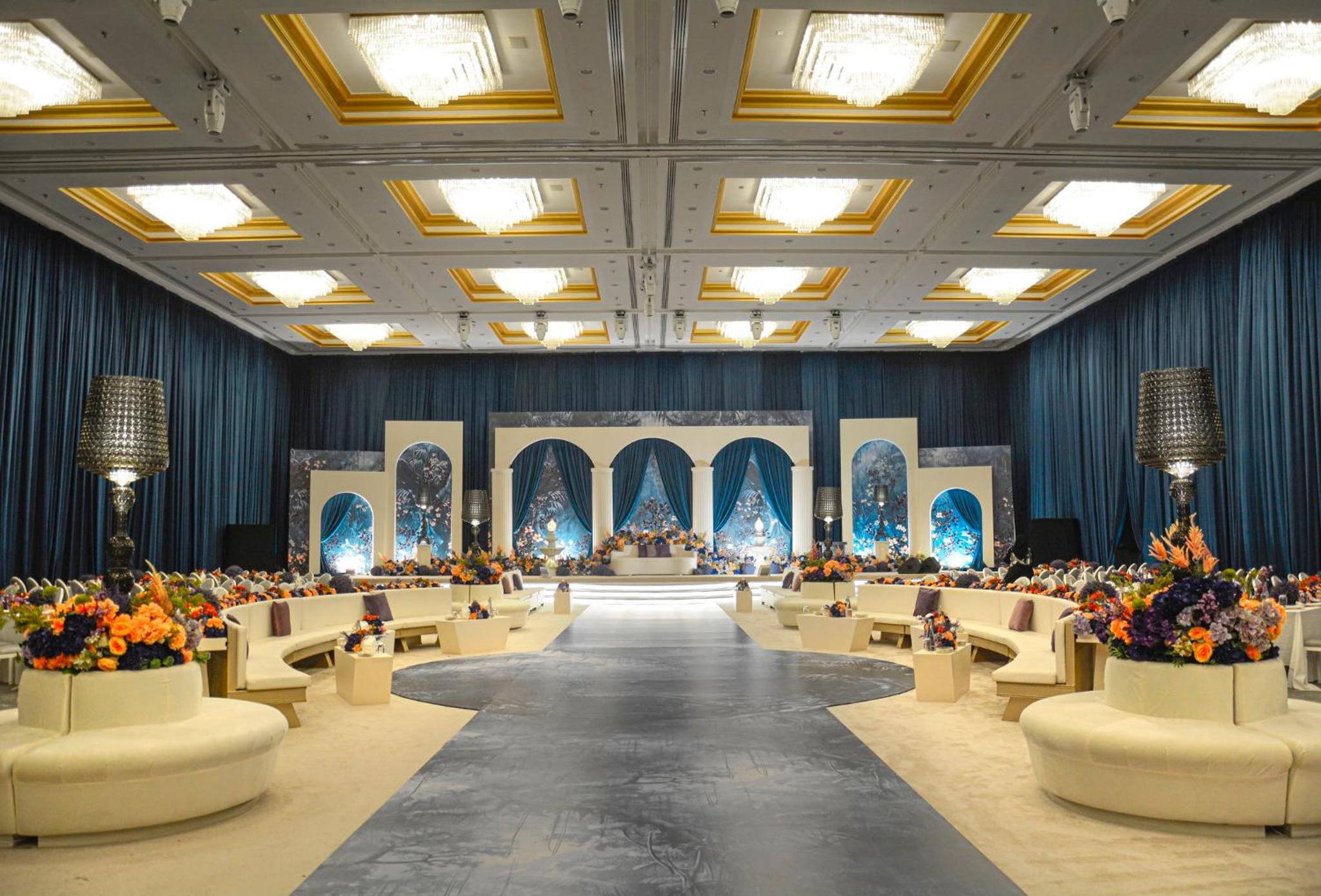 a large room with chairs and flowers in it at Crowne Plaza Bahrain by IHG in Manama +209 photos