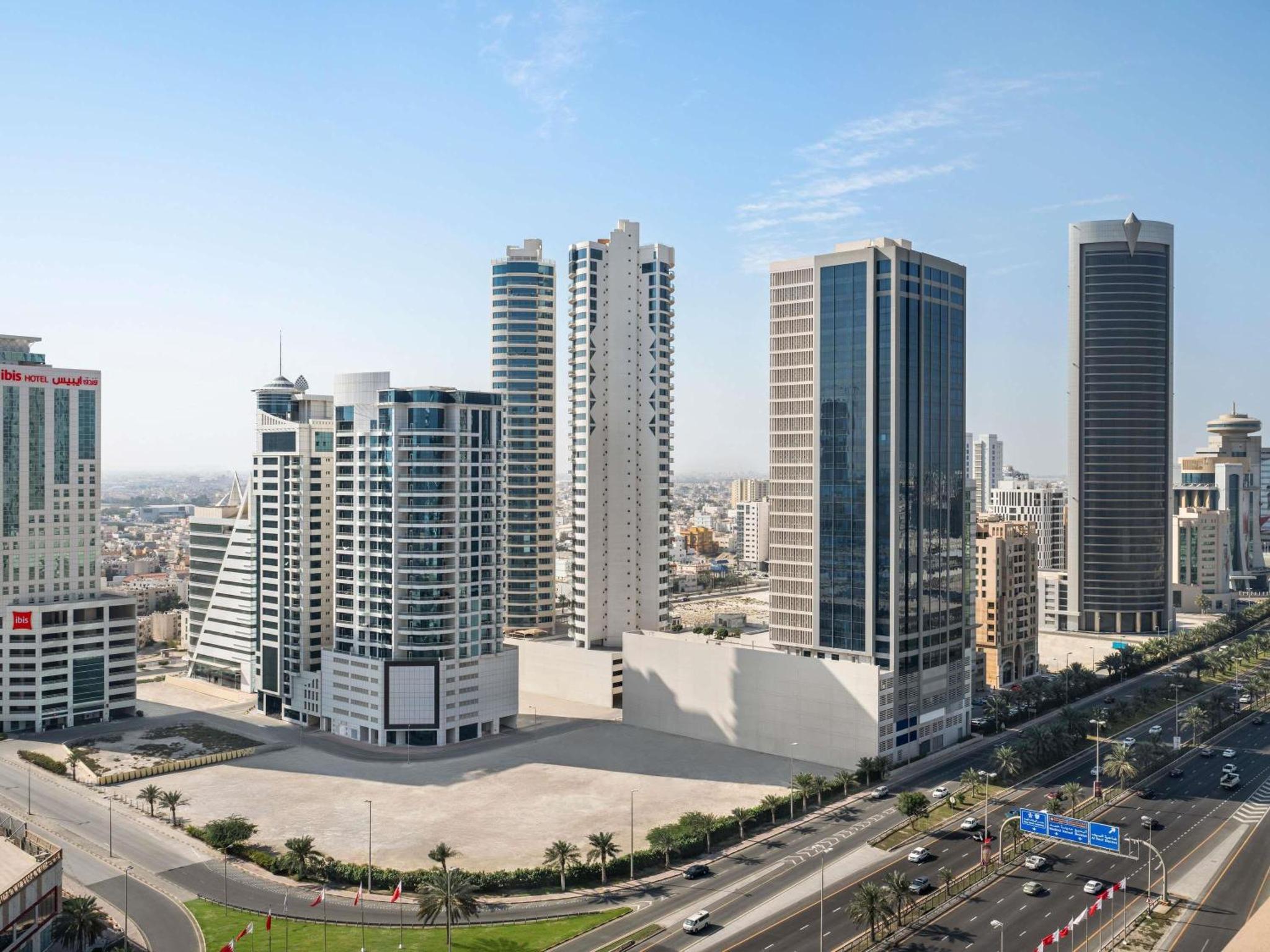 a view of a city with tall buildings at ibis Seef Manama in Manama