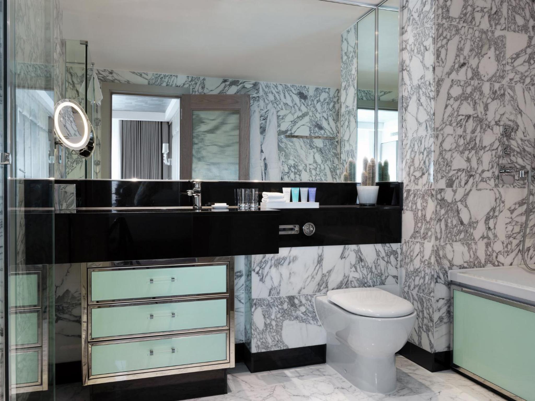 a bathroom with a sink and a toilet at The Marylebone Hotel in London