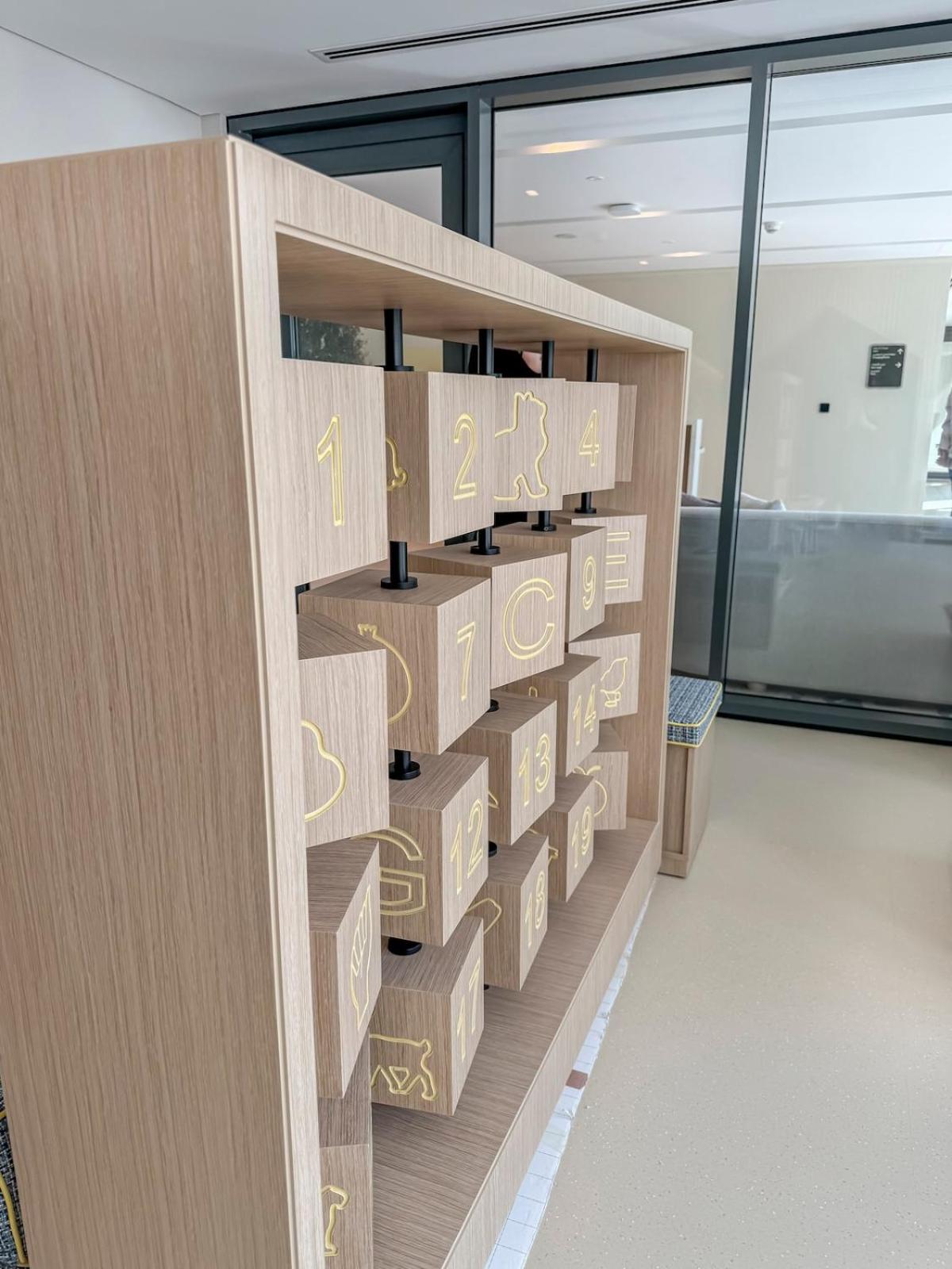 a shelf filled with boxes in a room with windows at Luxurious Studio in Marassi Vista with Beach Access in Amwaj Island +21 photos