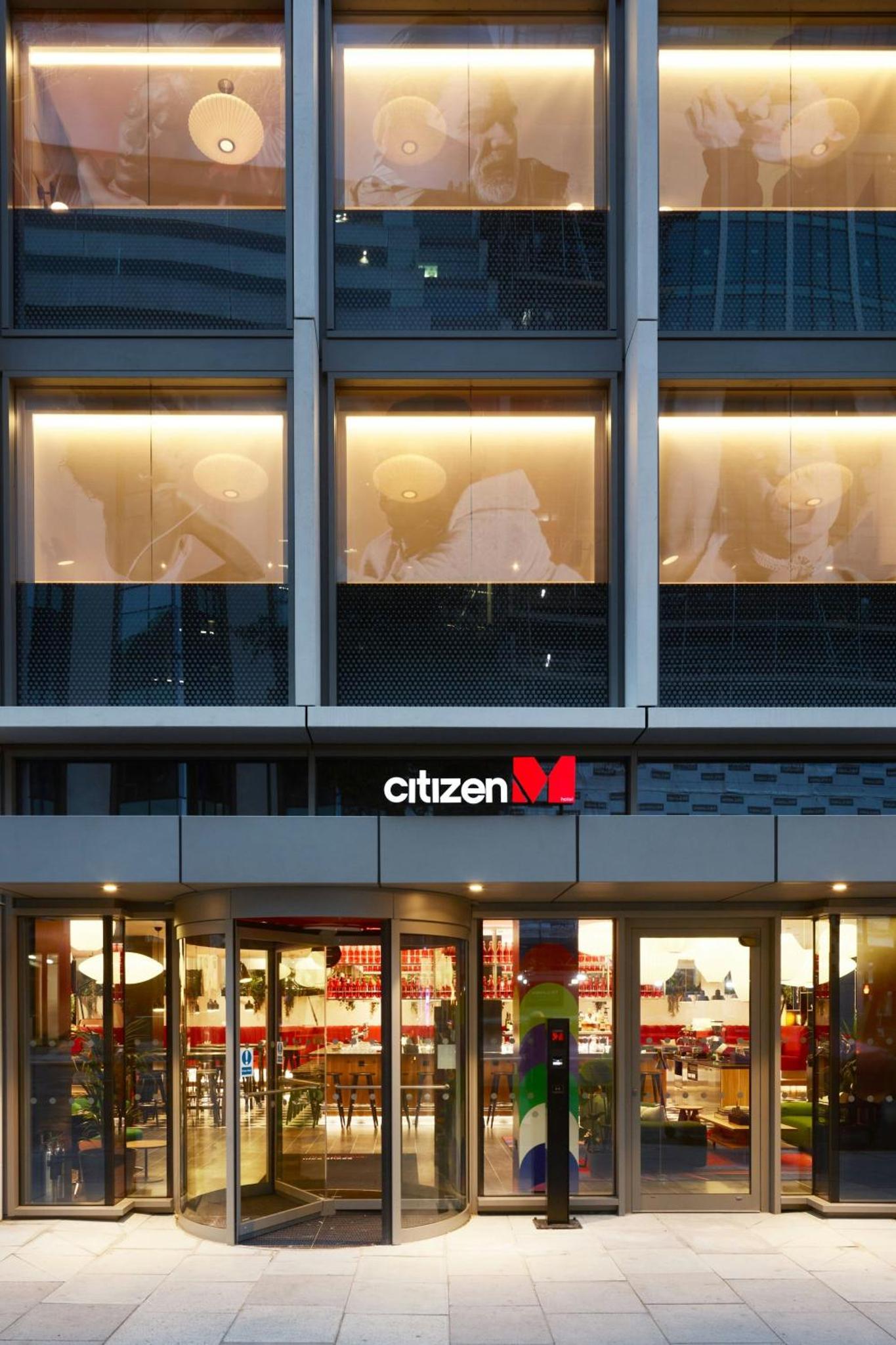 a building with a gilbert sign in front of it at citizenM London Victoria Station in London