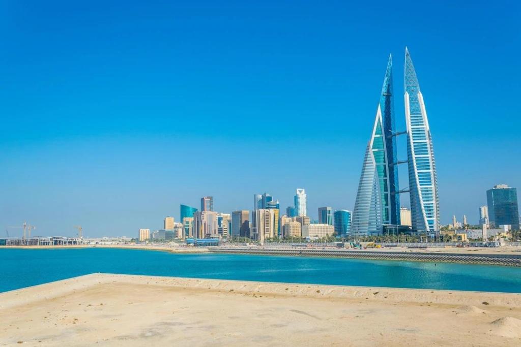a view of a city with a tall building at HAVEN TOWER in Juffair