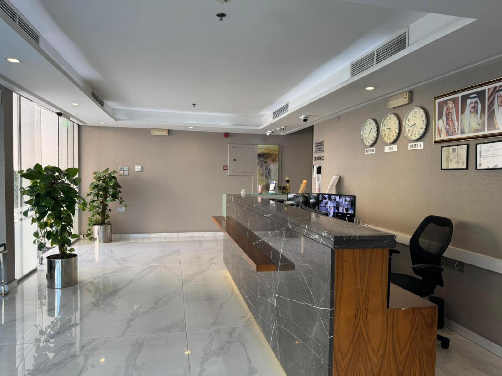 a bar in a dental office with a counter at INFINITY Suites Juffair in Manama +30 photos