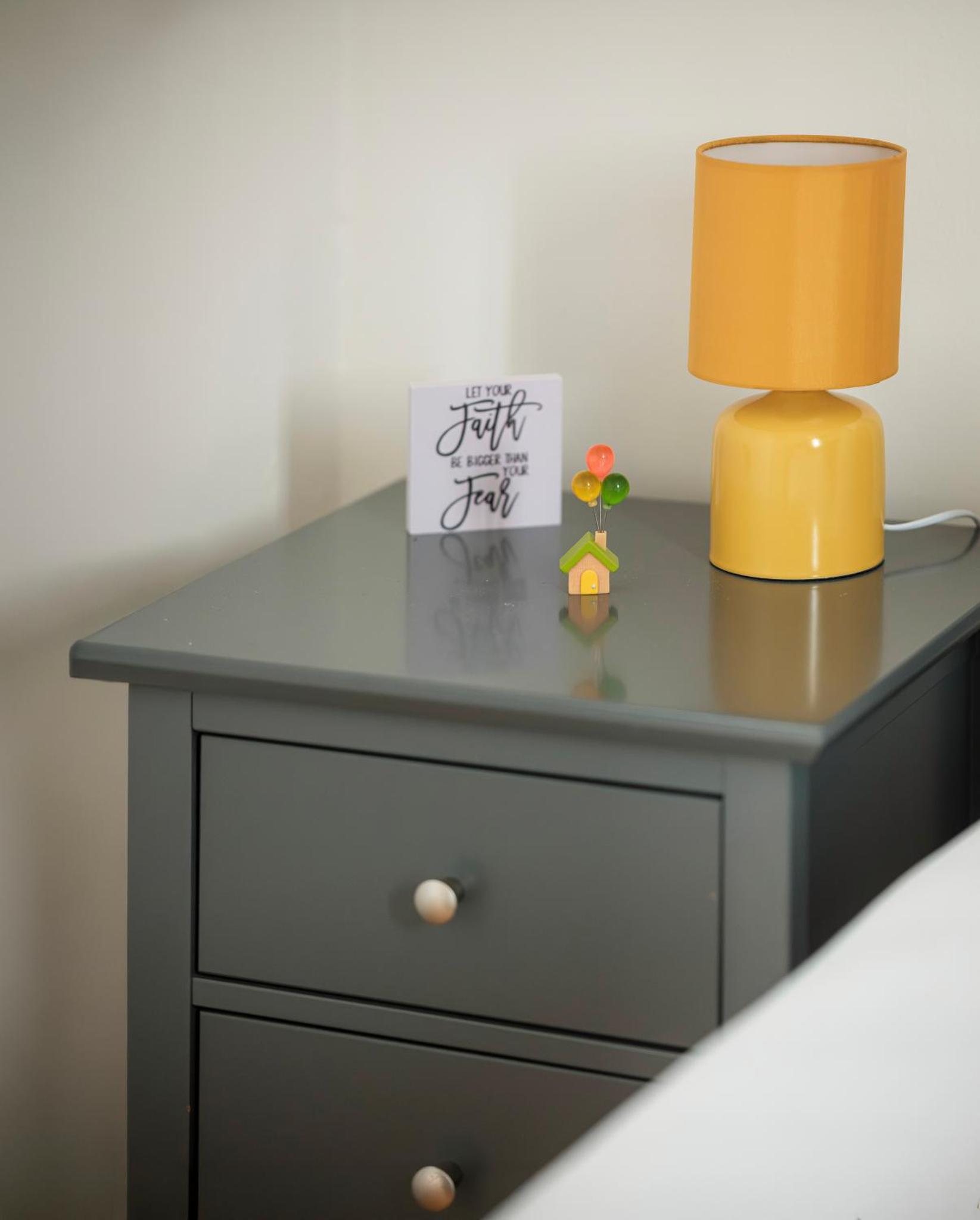 a gray dresser with a lamp on top of it at 3 of 5 Room Cozy, spacious and modern in Camden Town in London +2 photos
