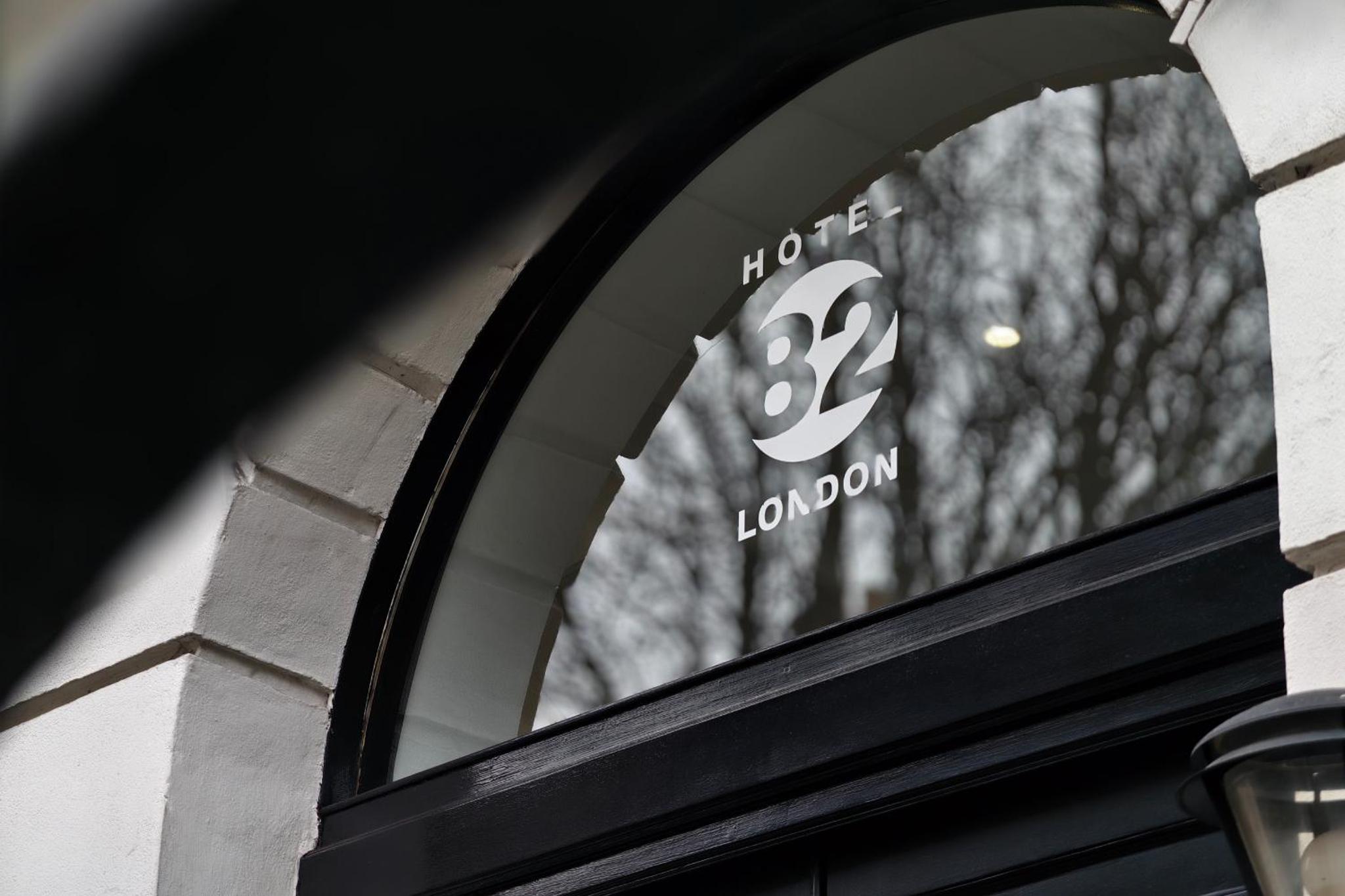 a window of a building with the number on it at MSK Hotel 82 in London