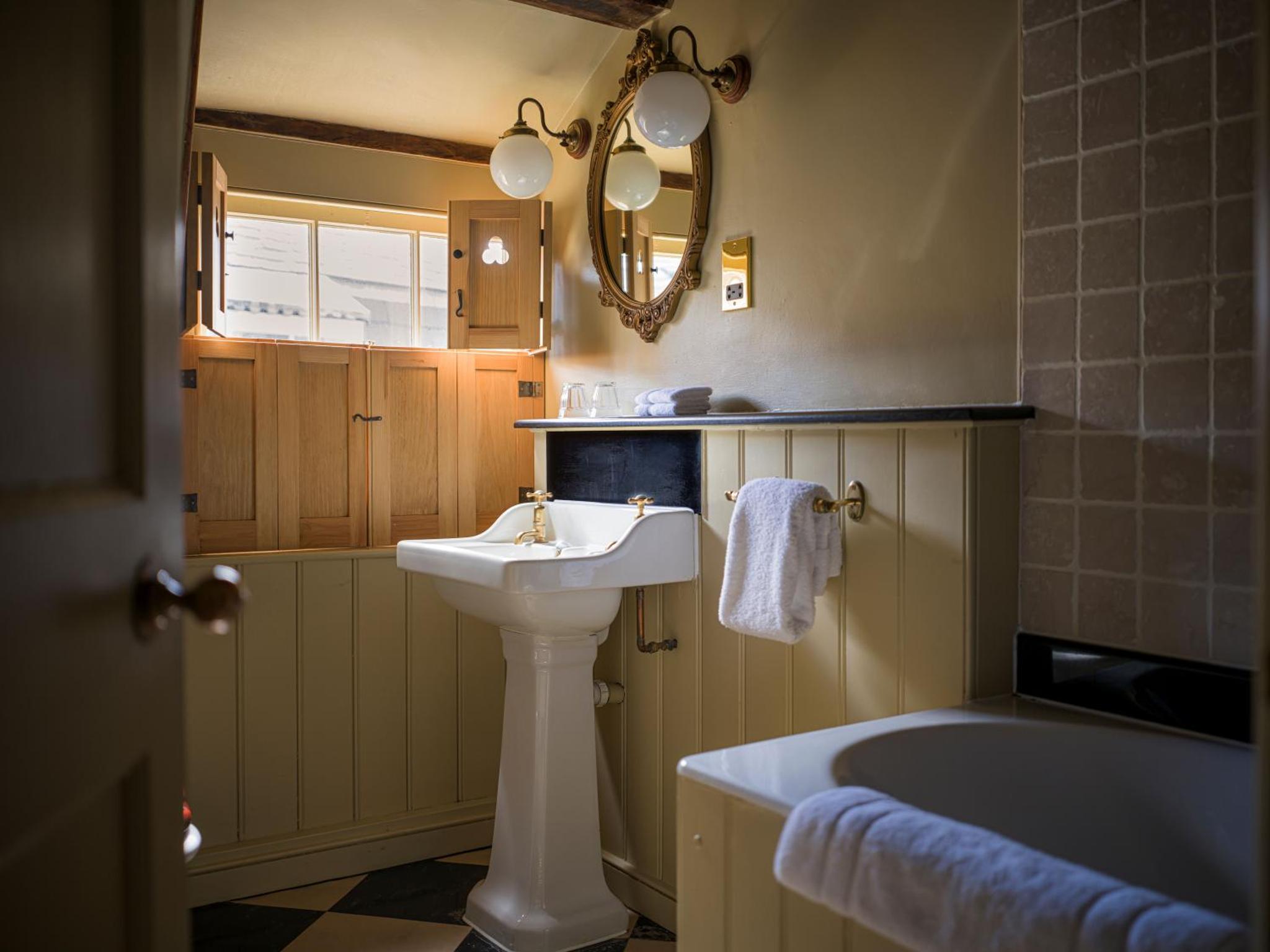 a bathroom with a sink and a bath tub at The Rookery in London +54 photos