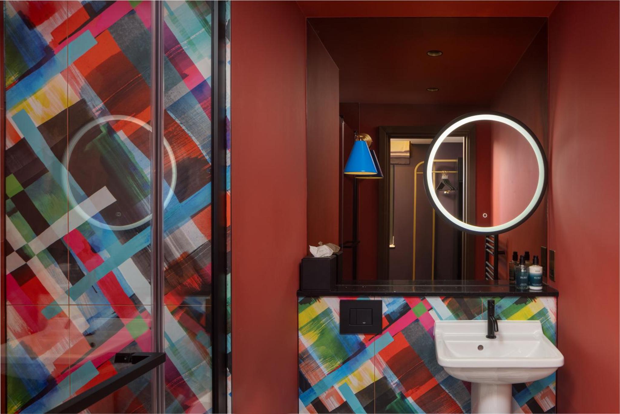 a bathroom with a sink and a mirror at The Kensington Hideaway in London +49 photos