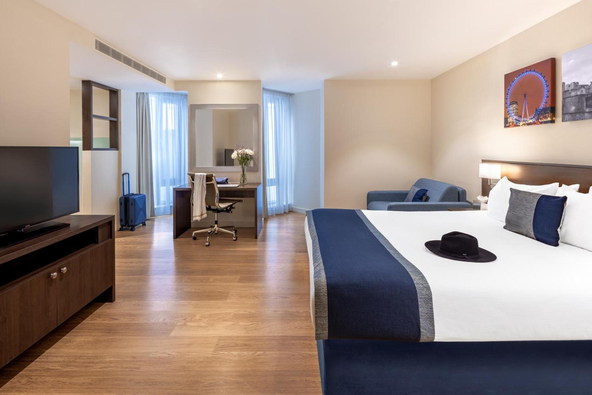 a hotel room with a large bed and a television at Marlin Waterloo in London