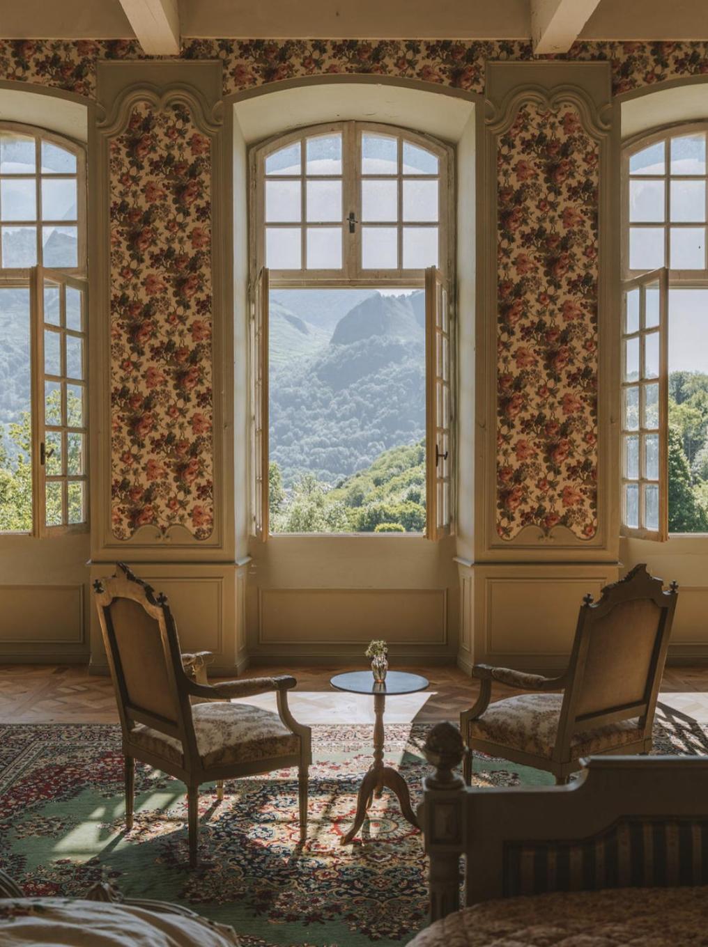 Chairs and a table by the windows, Family Suite