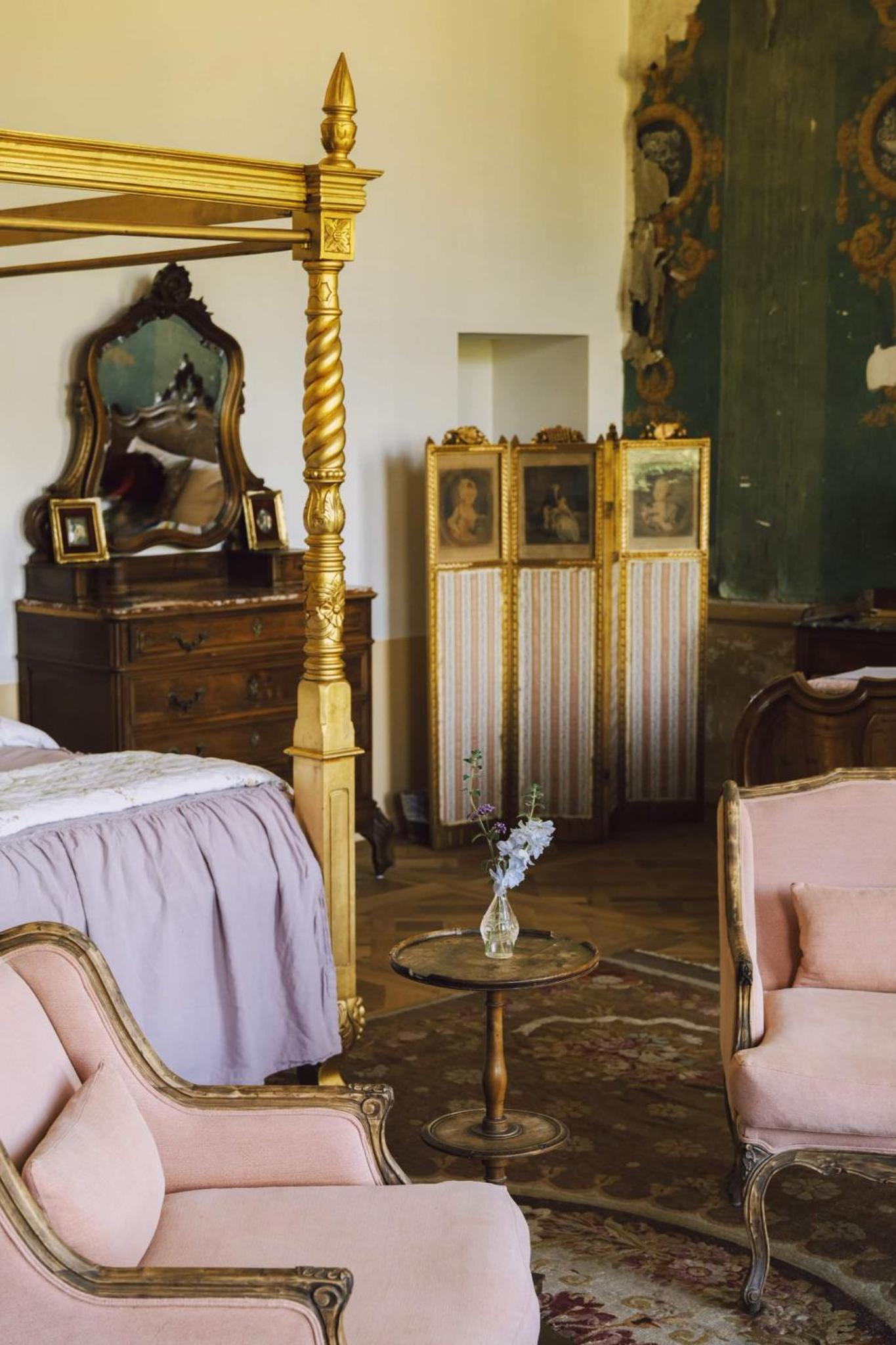 The Gold Suite, the bed and a table