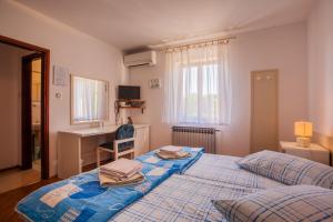 Ліжко або ліжка в номері Rooms Kučić