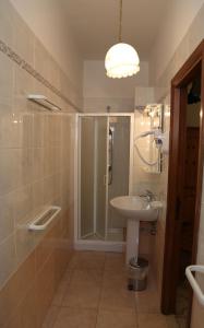 a bathroom with a shower and a sink at Antica Pensione Pinna in Castelsardo