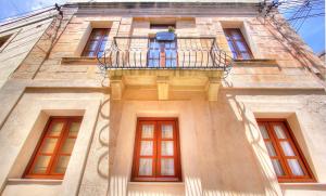 a building with a balcony and windows at My Travel House in Rabat