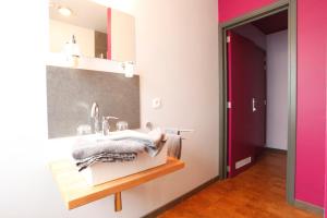 a bathroom with a sink and a mirror at Hotel O Mal Aime in Stavelot